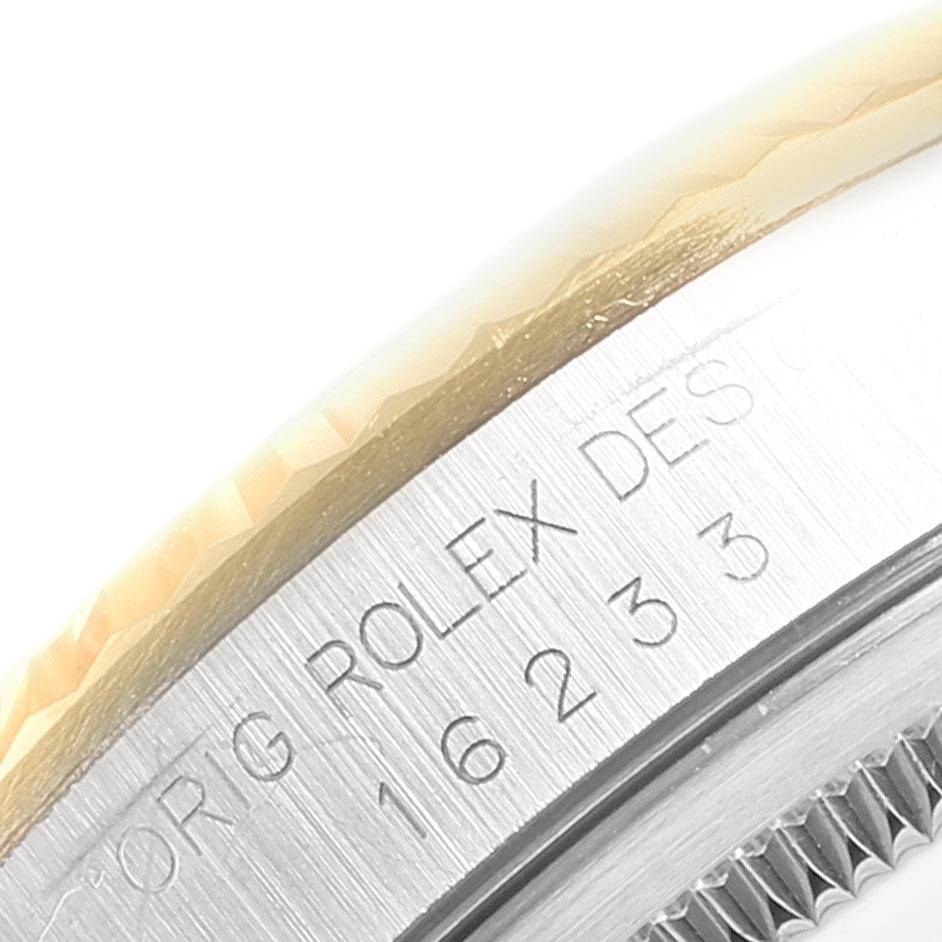 This image shows a close-up of the Rolex Datejust 16233 Men
s Steel and Gold (two tone) Champagne Dial 16233 Men
s Steel and Gold (two tone) Champagne Dial model
s bezel and case with engraved details.