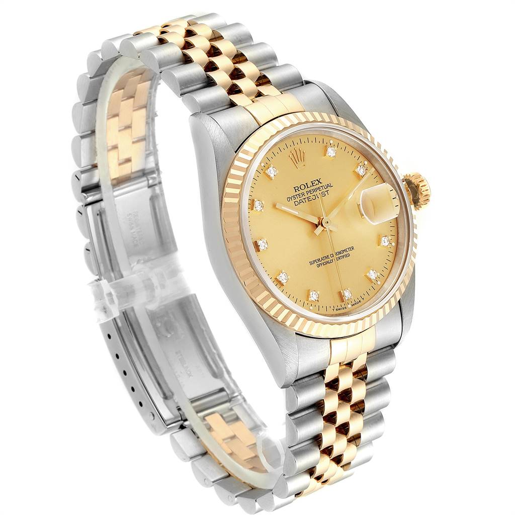 The image shows a Rolex Datejust 16233 Men
s Steel and Gold (two tone) Champagne Dial 16233 Men
s Steel and Gold (two tone) Champagne Dial watch at a three-quarter angle, showcasing its dial, fluted bezel, and two-tone bracelet.