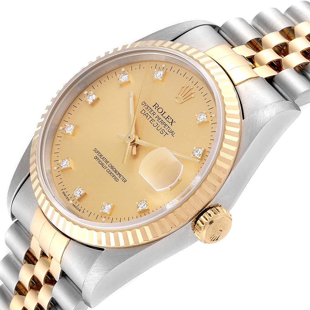 The Rolex Datejust 16233 Men
s Steel and Gold (two tone) Champagne Dial 16233 Men
s Steel and Gold (two tone) Champagne Dial watch is shown at an angled close-up, highlighting its gold dial, fluted bezel, and jubilee bracelet.