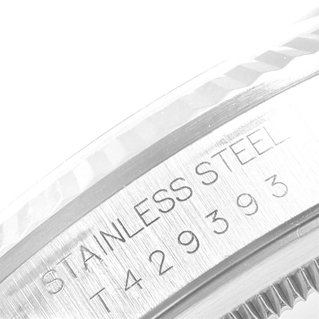 This image shows a close-up of the stainless steel side case and bezel edge of a Rolex Datejust 16234 Men's Stainless Steel Silver Dial 16234 Men's Stainless Steel Silver Dial watch.