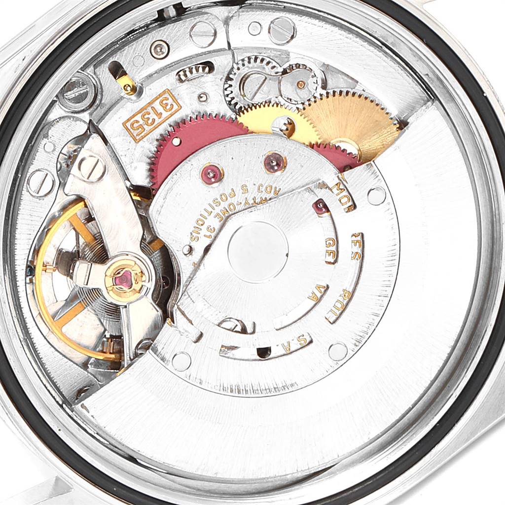 The image shows a close-up view of the movement mechanism inside a Rolex Datejust 16234 Men's Stainless Steel Silver Dial 16234 Men's Stainless Steel Silver Dial watch, highlighting gears and components.