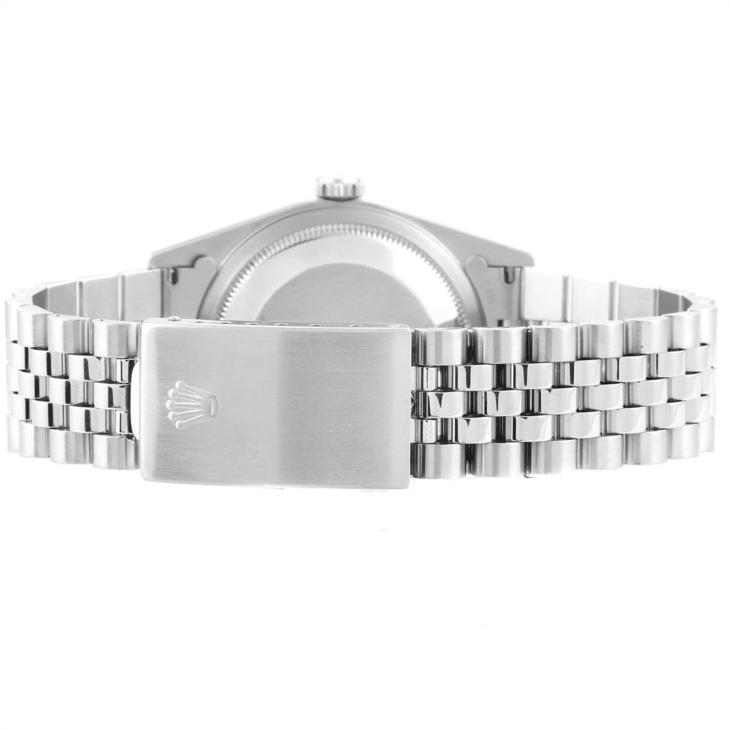 The image shows the back view of the Rolex Datejust 16234 Men's Stainless Steel Silver Dial 16234 Men's Stainless Steel Silver Dial watch showcasing its clasp and stainless steel bracelet.