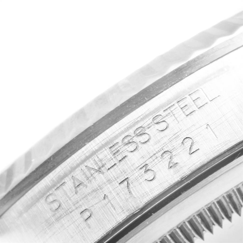 The image shows a close-up of the engraved bezel of a stainless steel Rolex Datejust 16234 Men's Stainless Steel Silver Dial 16234 Men's Stainless Steel Silver Dial watch.