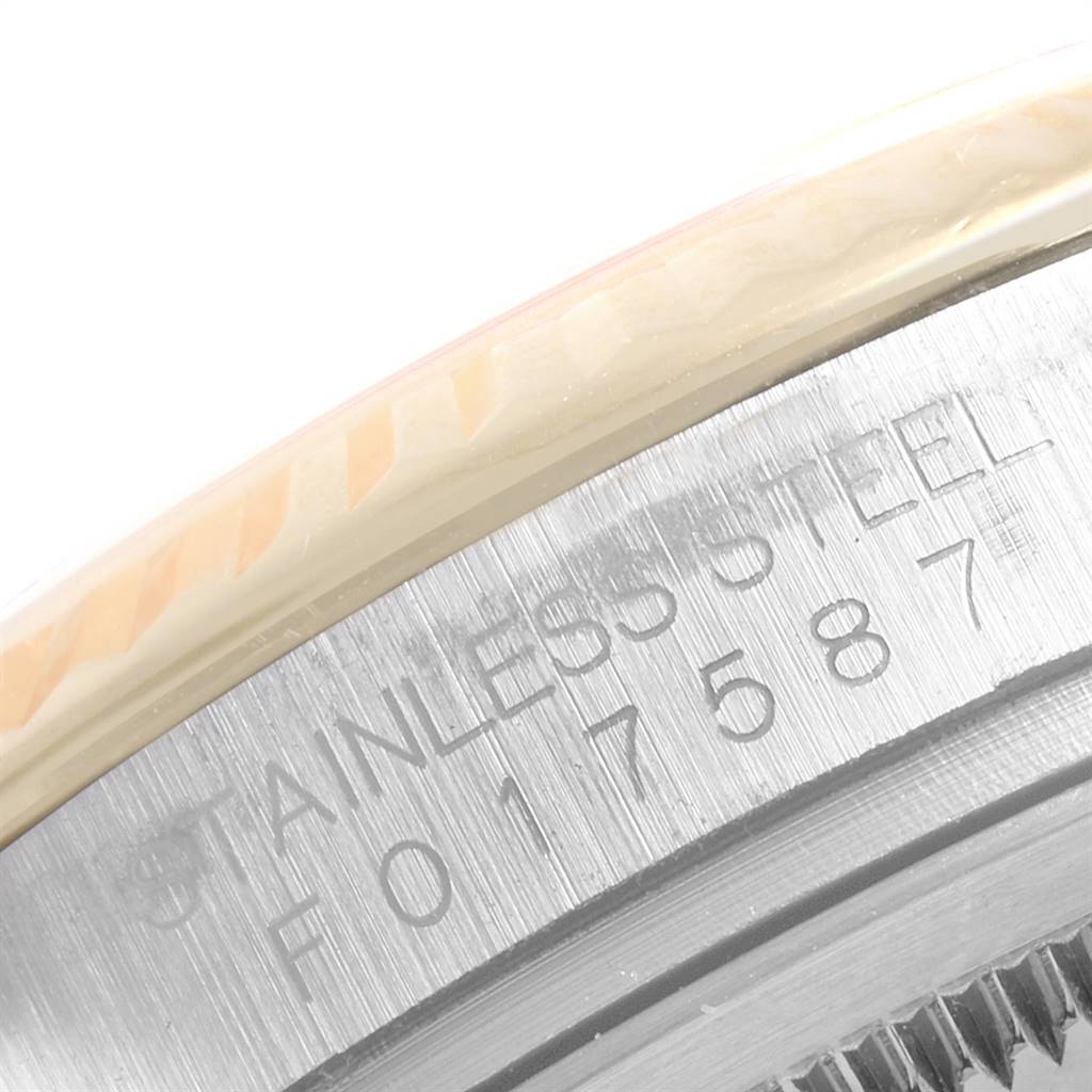 The image shows a close-up of the case side and the bezel of a Rolex Datejust 116233 Men's Stainless Steel Mother of Pearl Dial 116233 Men's Stainless Steel Mother of Pearl Dial watch, with "STAINLESS STEEL" engraved.