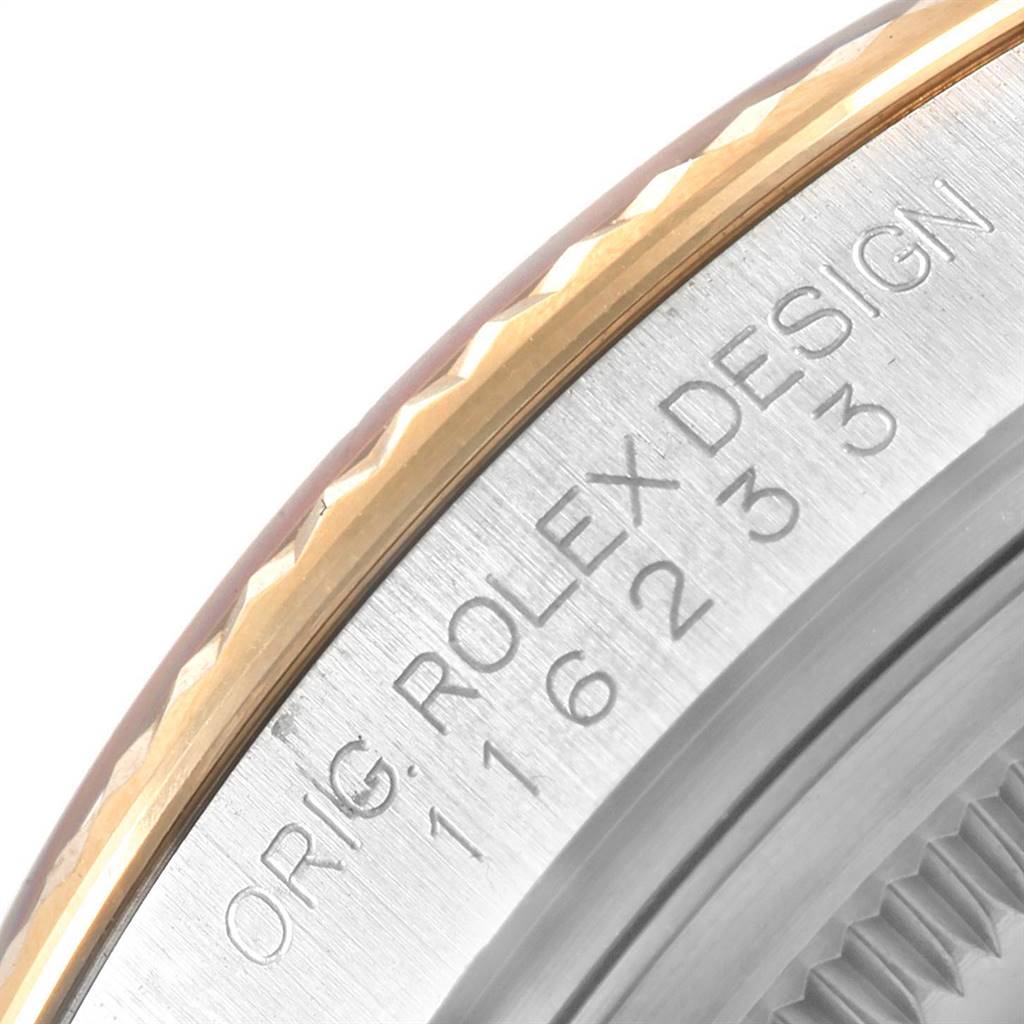 This image shows a close-up angle of the bezel and case side of a Rolex Datejust 116233 Men's Stainless Steel Mother of Pearl Dial 116233 Men's Stainless Steel Mother of Pearl Dial watch, highlighting the engraved text.