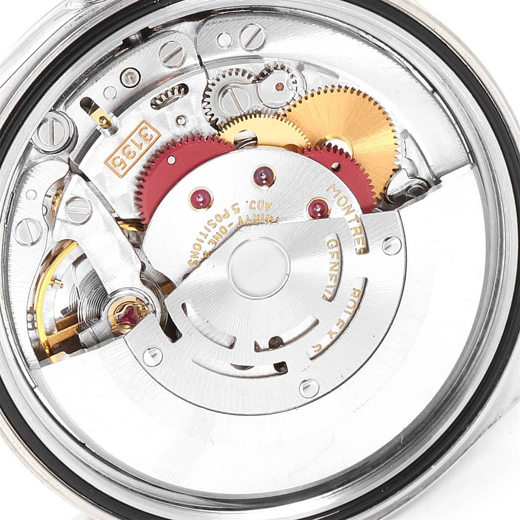 The image shows the movement and intricate inner mechanical parts of a Rolex Datejust 16233 Men's Steel and Gold (two tone) Beige Dial 16233 Men's Steel and Gold (two tone) Beige Dial watch.