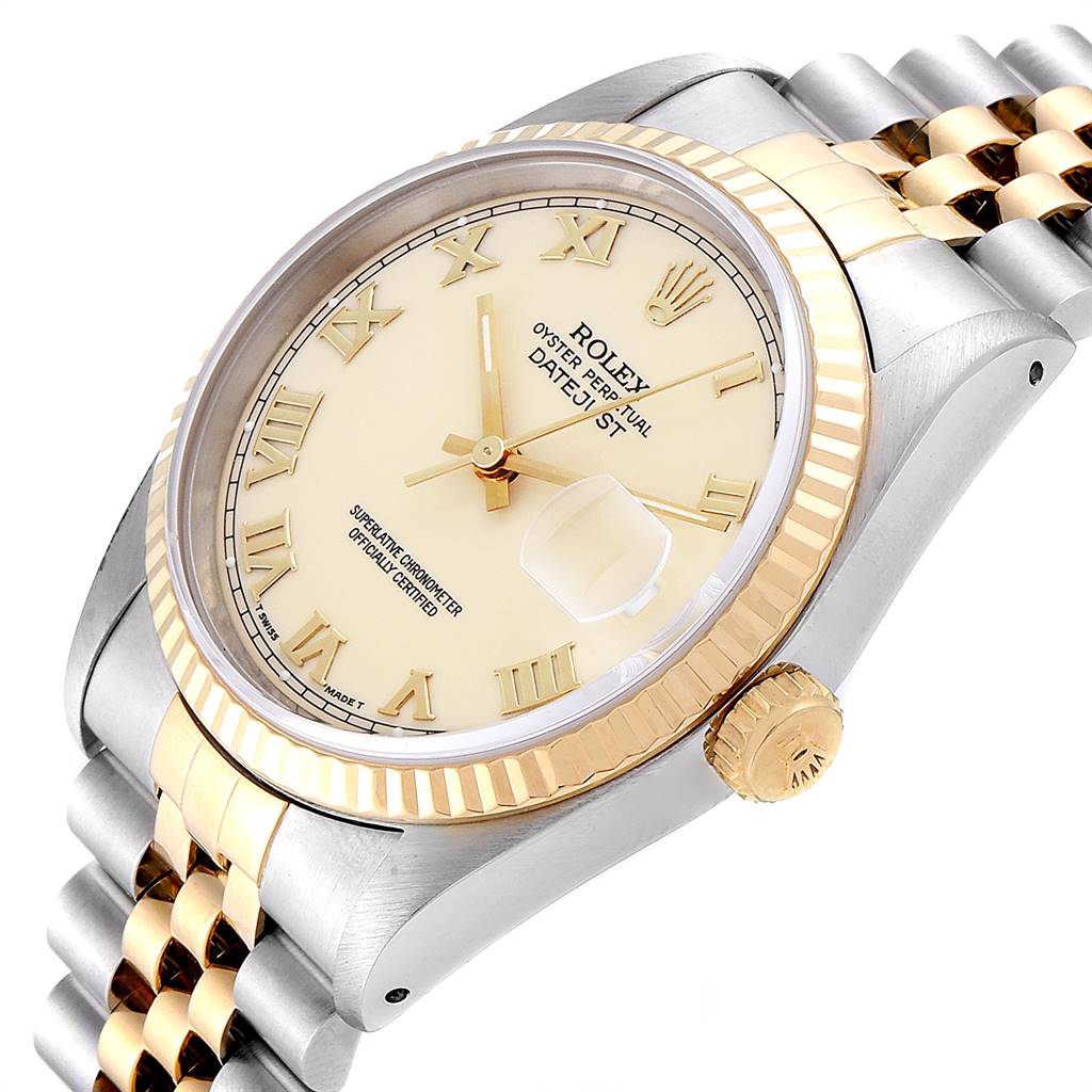 The image shows an angled view of the Rolex Datejust 16233 Men's Steel and Gold (two tone) Beige Dial 16233 Men's Steel and Gold (two tone) Beige Dial watch, highlighting its dial, bezel, crown, and a portion of the bracelet.
