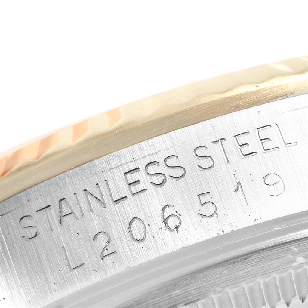 This image shows a close-up of the case side and engraving of a Rolex Datejust 16233 Men's Steel and Gold (two tone) Champagne Dial 16233 Men's Steel and Gold (two tone) Champagne Dial watch, indicating "STAINLESS STEEL" and a reference number.