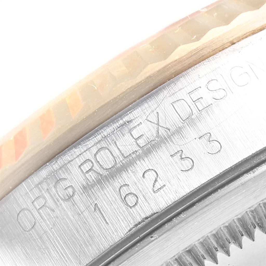 The image shows a close-up of the engraved model number and bezel of a Rolex Datejust 16233 Men's Steel and Gold (two tone) Champagne Dial 16233 Men's Steel and Gold (two tone) Champagne Dial watch.