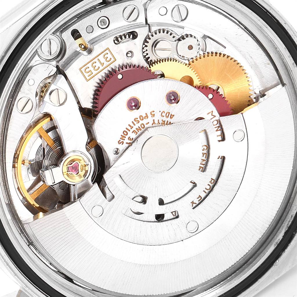 This image shows the intricate internal mechanism of a Rolex Datejust 16233 Men's Steel and Gold (two tone) Champagne Dial 16233 Men's Steel and Gold (two tone) Champagne Dial watch, highlighting the gears and oscillating weight.