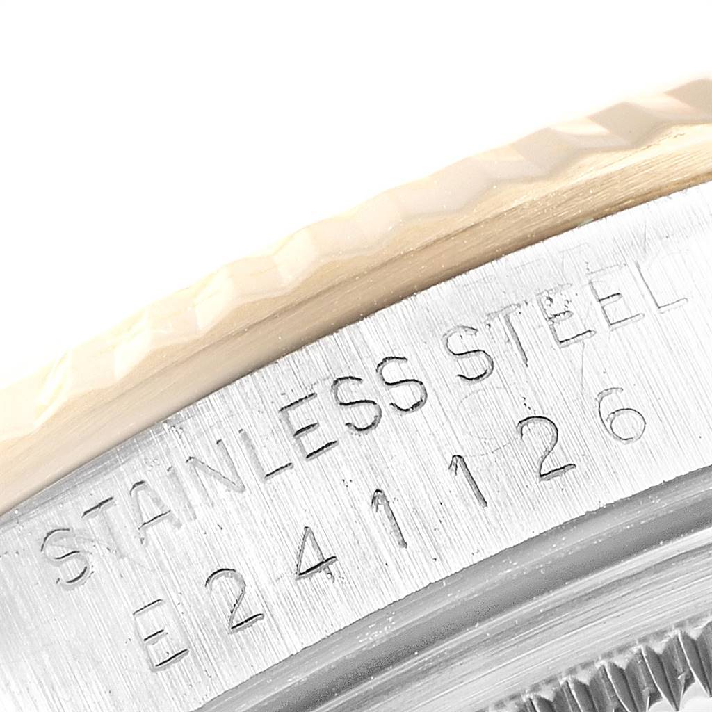 This image shows a close-up of the side engraving on a Rolex Datejust 16233 Men's Steel and Gold (two tone) Champagne Dial 16233 Men's Steel and Gold (two tone) Champagne Dial stainless steel watch case.