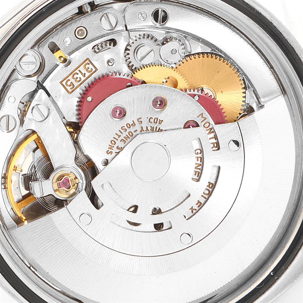 This close-up image shows the movement mechanism of the Rolex Datejust 16233 Men's Steel and Gold (two tone) Champagne Dial 16233 Men's Steel and Gold (two tone) Champagne Dial watch, showcasing gears and the rotor.