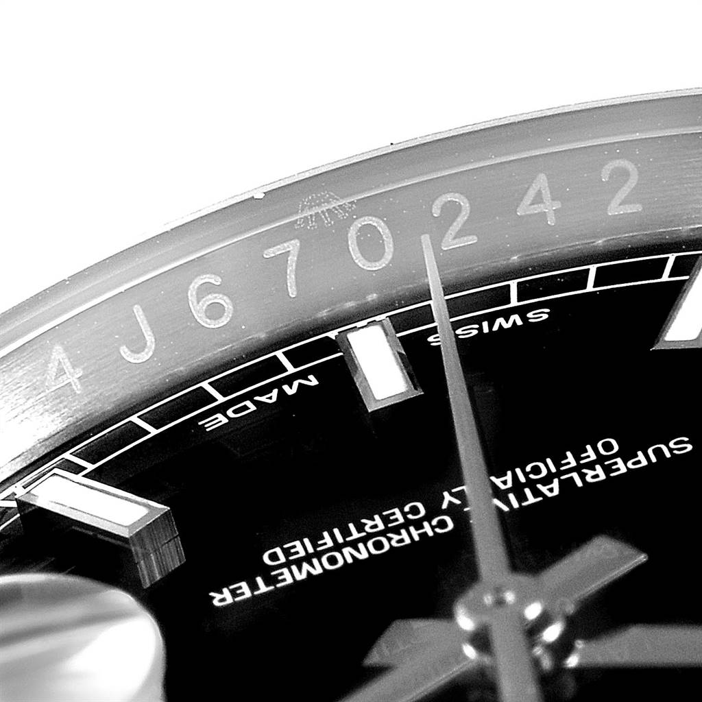 The image shows a close-up of the dial and bezel of a Rolex Datejust 116234 Men's Stainless Steel Black Dial 116234 Men's Stainless Steel Black Dial watch, highlighting numerals and text on the face.