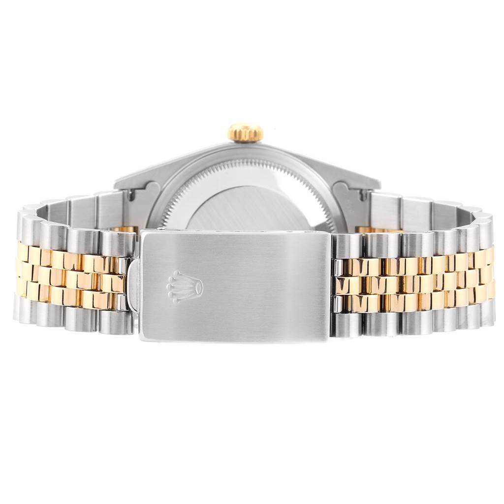This image shows the clasp, case back, and bracelet of a Rolex Datejust 16233 Men's Steel and Gold (two tone) Champagne Dial 16233 Men's Steel and Gold (two tone) Champagne Dial watch from a rear angle.
