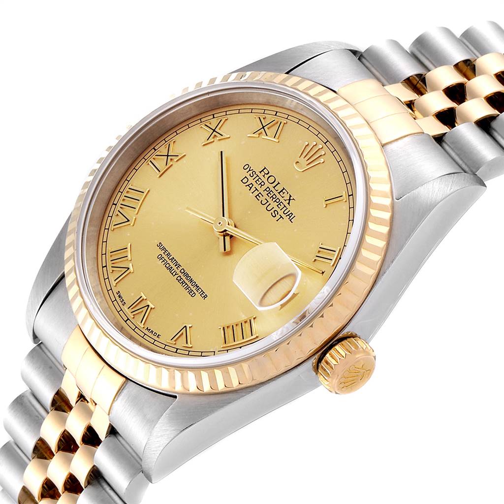 The image shows a Rolex Datejust 16233 Men's Steel and Gold (two tone) Champagne Dial 16233 Men's Steel and Gold (two tone) Champagne Dial watch from a slight side angle, highlighting its gold dial, fluted bezel, and jubilee bracelet.