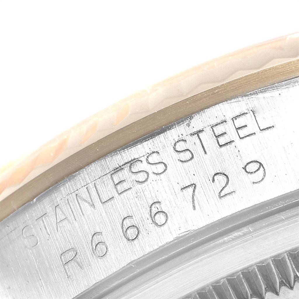This image shows a close-up of the case back of a Rolex Datejust 16233 Men
s Steel and Gold (two tone) Champagne Dial 16233 Men
s Steel and Gold (two tone) Champagne Dial, highlighting the stainless steel engravings and serial number.