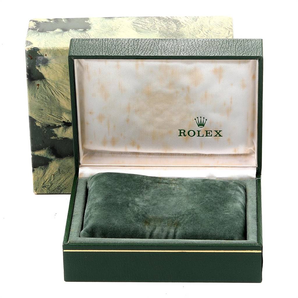 The image shows the empty green leather box of a Rolex Datejust 16233 Men
s Steel and Gold (two tone) Champagne Dial 16233 Men
s Steel and Gold (two tone) Champagne Dial watch, with the box open to reveal the cushion inside.
