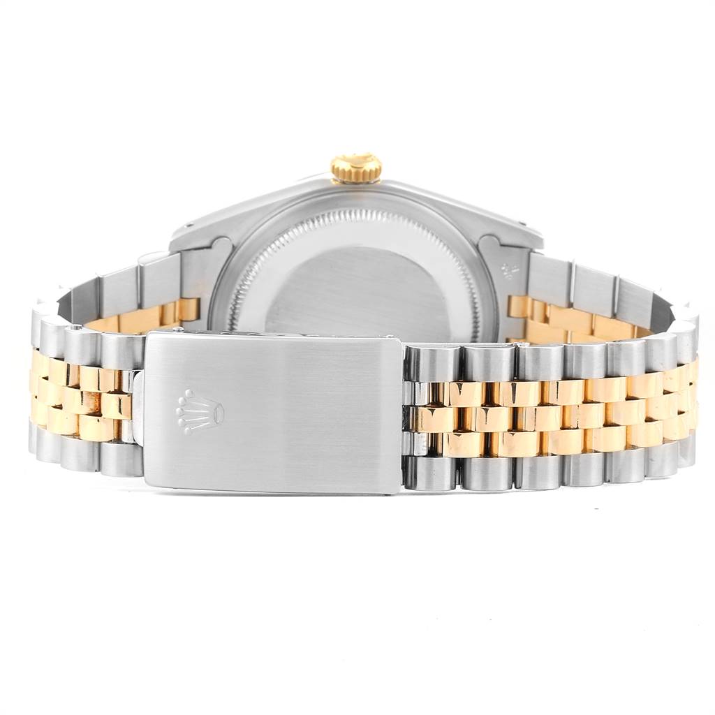 This image shows the back case and clasp of a Rolex Datejust 16233 Men
s Steel and Gold (two tone) Champagne Dial 16233 Men
s Steel and Gold (two tone) Champagne Dial watch, featuring a two-tone stainless steel and gold bracelet.