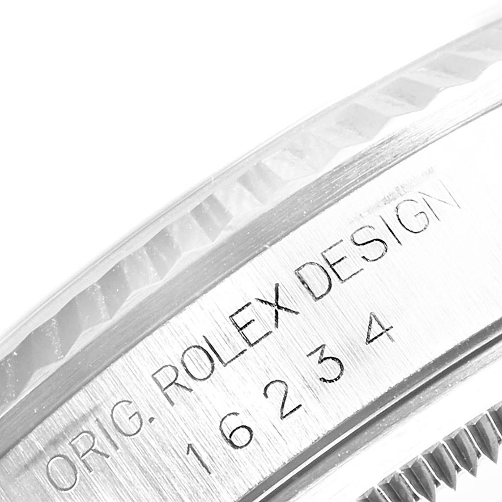 The image shows a close-up of the serial number and engraving on the side of a Rolex Datejust 16234 Men's Stainless Steel Silver Dial 16234 Men's Stainless Steel Silver Dial watch case.