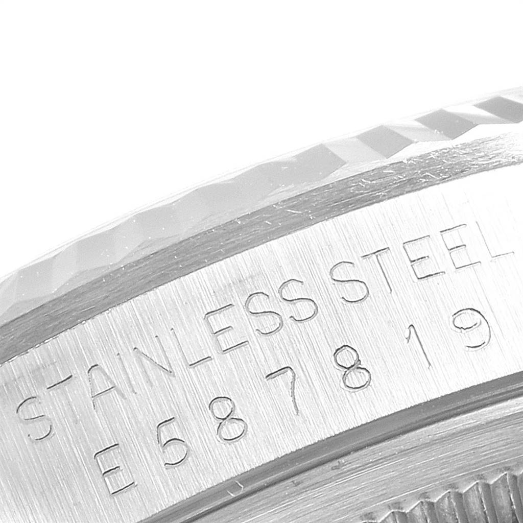 The image shows a close-up of the case side and bezel of a Rolex Datejust 16234 Men's Stainless Steel Silver Dial 16234 Men's Stainless Steel Silver Dial watch with the stainless steel engraving and serial number.