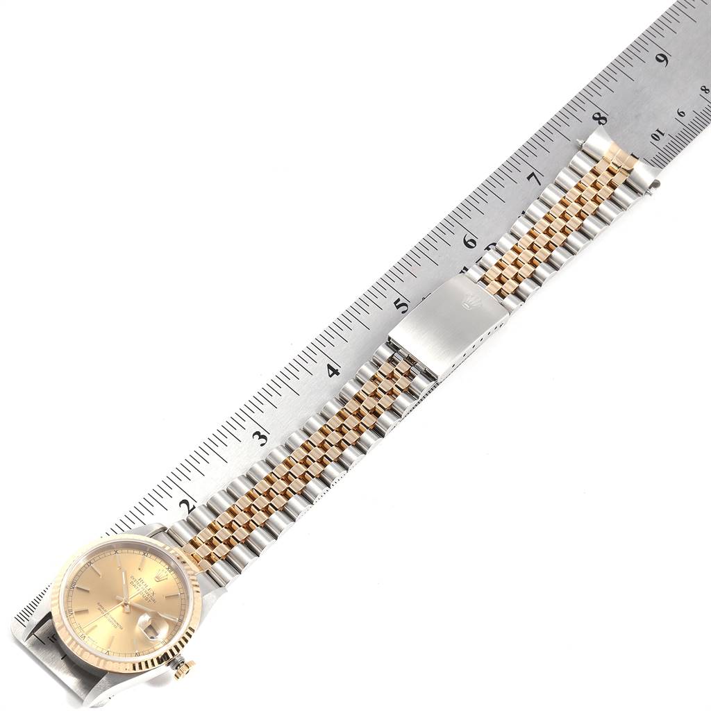 The image shows a Rolex Datejust 16233 Men's Steel and Gold (two tone) Champagne Dial 16233 Men's Steel and Gold (two tone) Champagne Dial watch laid flat with a ruler measuring its length.