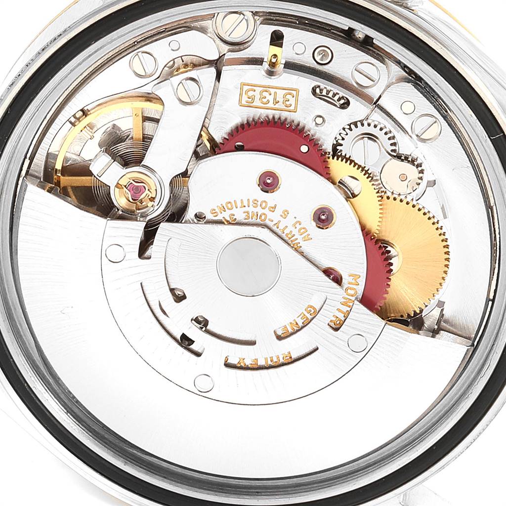 This image shows the intricate inner mechanics of a Rolex Datejust 16233 Men's Steel and Gold (two tone) Champagne Dial 16233 Men's Steel and Gold (two tone) Champagne Dial watch movement from a back or bottom view.