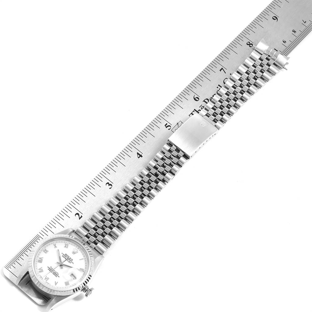 The image shows a side angle of a Rolex Datejust 16234 Men's Stainless Steel White Dial 16234 Men's Stainless Steel White Dial watch measuring its stainless steel band with a ruler.