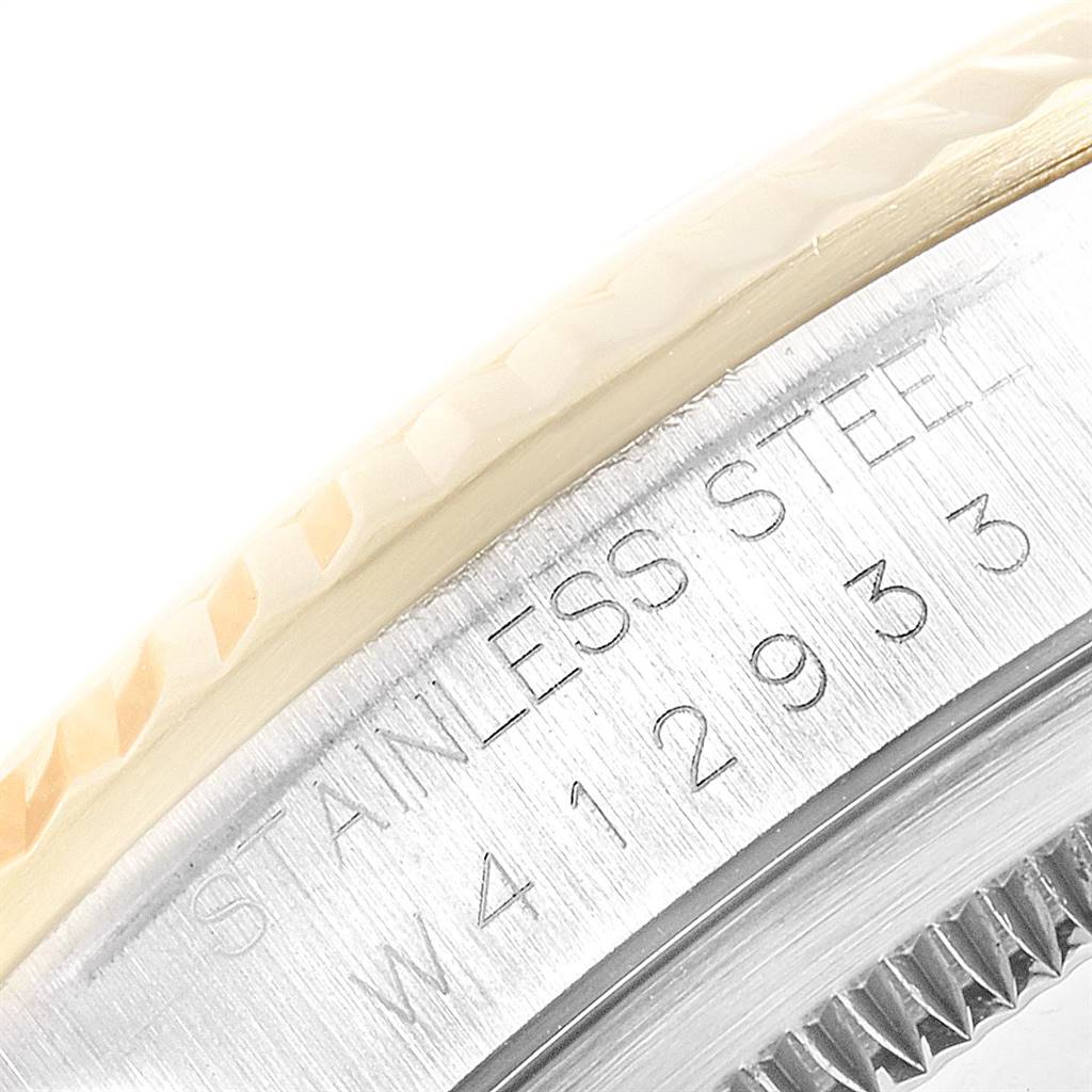 This is a close-up of the Rolex Datejust 16233 Men
s Steel and Gold (two tone) Champagne Dial 16233 Men
s Steel and Gold (two tone) Champagne Dial watch showing the stainless steel case and part of the bezel.