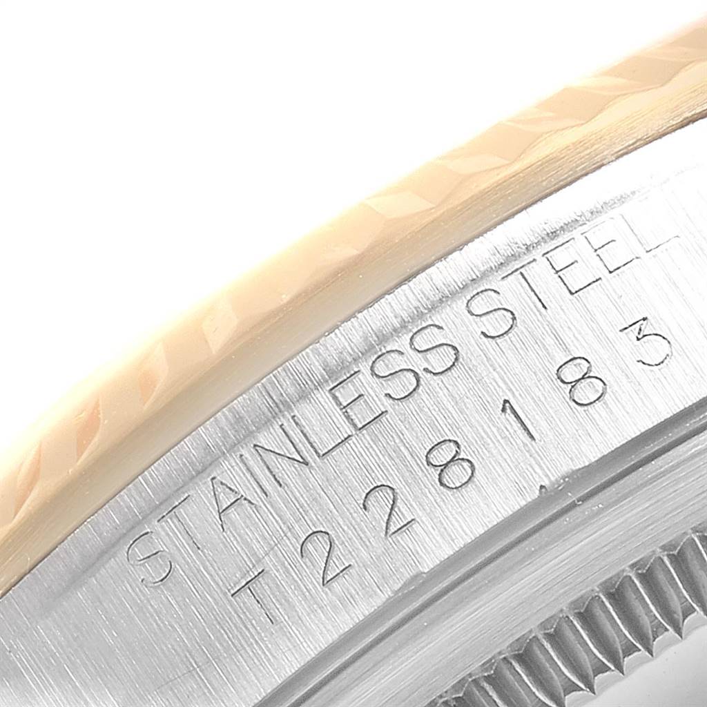 This close-up image of a Rolex Datejust 16233 Men's Steel and Gold (two tone) Champagne Dial 16233 Men's Steel and Gold (two tone) Champagne Dial model shows the stainless steel case with engraved details.