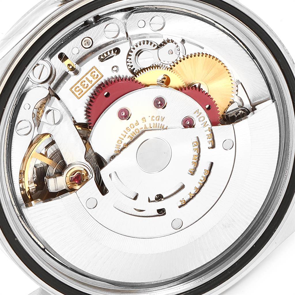 This image shows the intricate internal mechanics and gears of the Rolex Datejust 16233 Men's Steel and Gold (two tone) Champagne Dial 16233 Men's Steel and Gold (two tone) Champagne Dial watch, captured from a top-down angle.