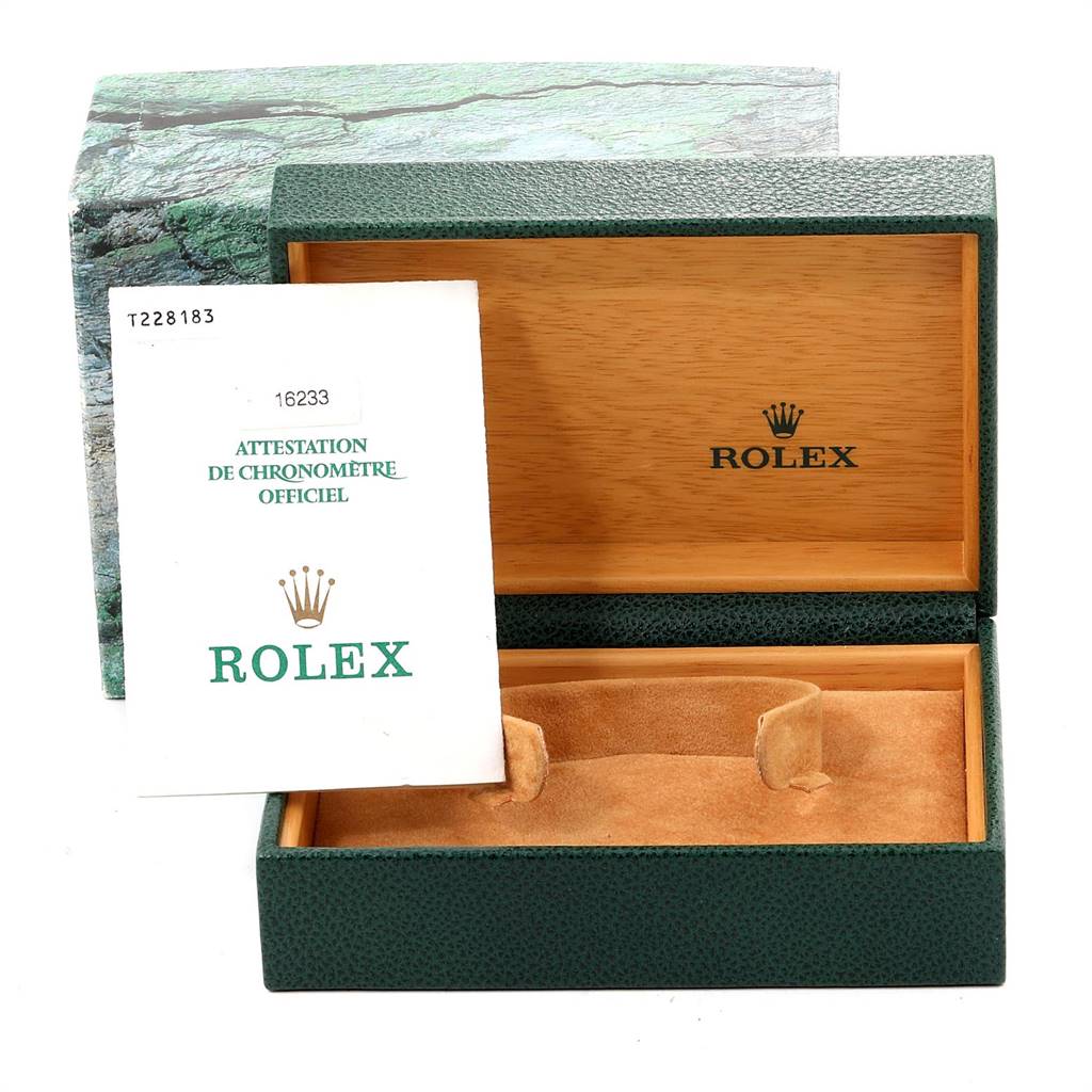 The image shows the open box and a certificate of a Rolex Datejust 16233 Men's Steel and Gold (two tone) Champagne Dial 16233 Men's Steel and Gold (two tone) Champagne Dial watch, highlighting the interior of the box.