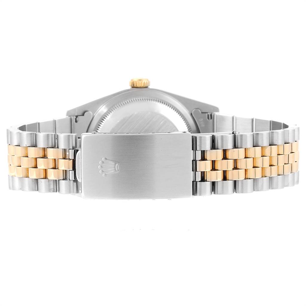 This image shows the rear view of the Rolex Datejust 16233 Men's Steel and Gold (two tone) Champagne Dial 16233 Men's Steel and Gold (two tone) Champagne Dial watch, focusing on its two-tone bracelet and clasp with the Rolex logo.