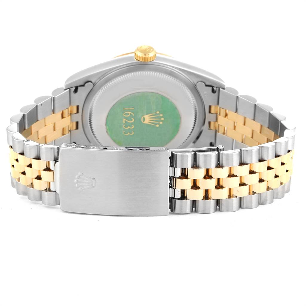 The image shows the backside of a Rolex Datejust 16233 Men's Steel and Gold (two tone) Blue Dial 16233 Men's Steel and Gold (two tone) Blue Dial watch, highlighting its jubilee bracelet and clasp.