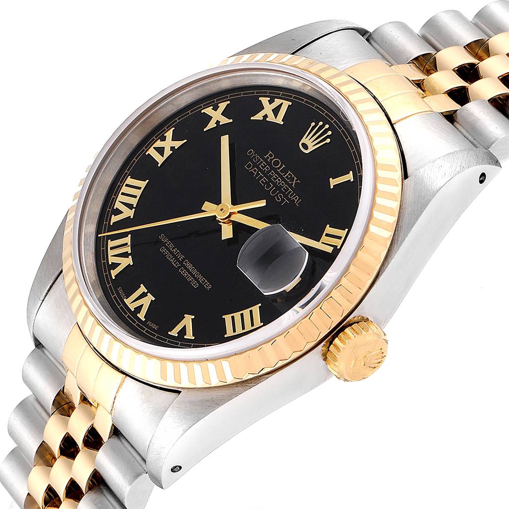 The image shows a close-up angle of the face, crown, and part of the bracelet of a Rolex Datejust 16233 Men
s Steel and Gold (two tone) Black Dial 16233 Men
s Steel and Gold (two tone) Black Dial watch.