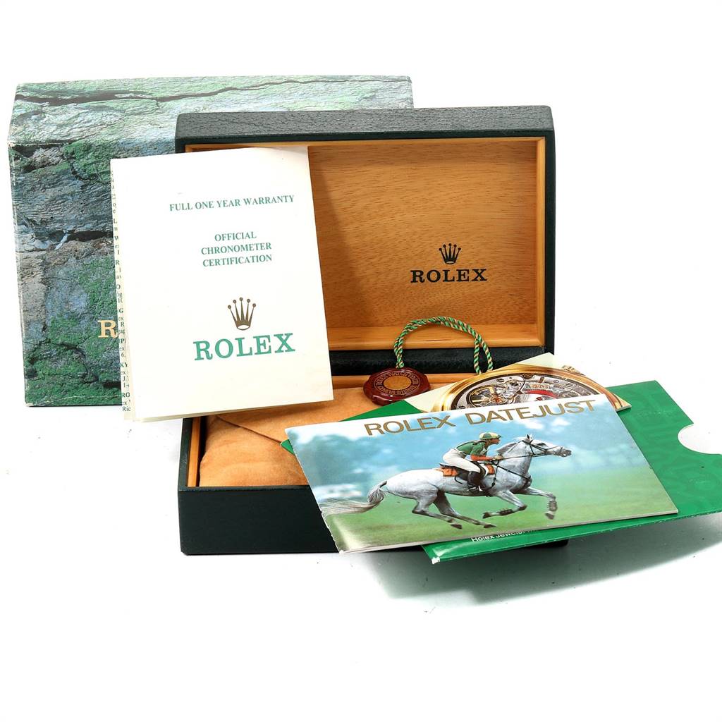 A Rolex Datejust 16233 Men's Steel and Gold (two tone) Champagne Dial 16233 Men's Steel and Gold (two tone) Champagne Dial box set with warranty, certification papers, and brochure is shown.