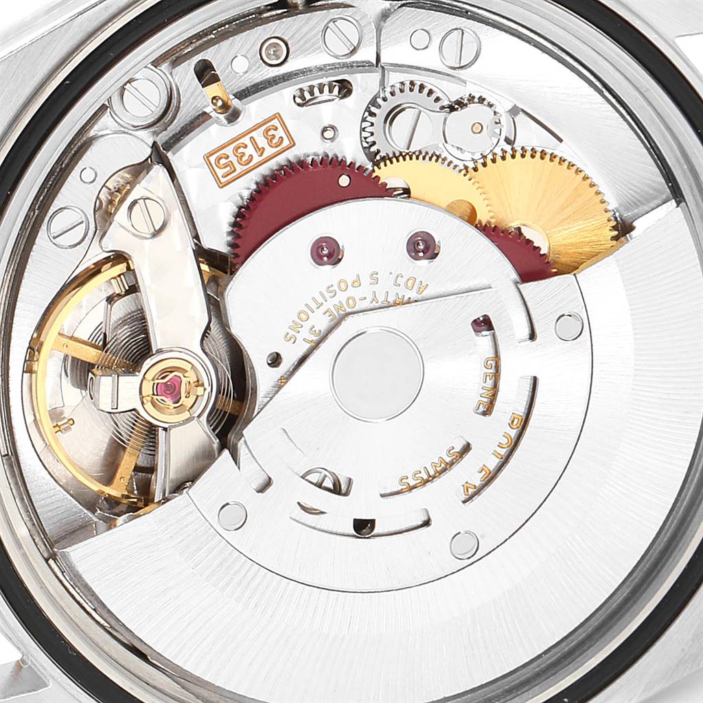 This is a close-up view of the intricate internal movement of a Rolex Datejust 16233 Men's Steel and Gold (two tone) Champagne Dial 16233 Men's Steel and Gold (two tone) Champagne Dial watch.