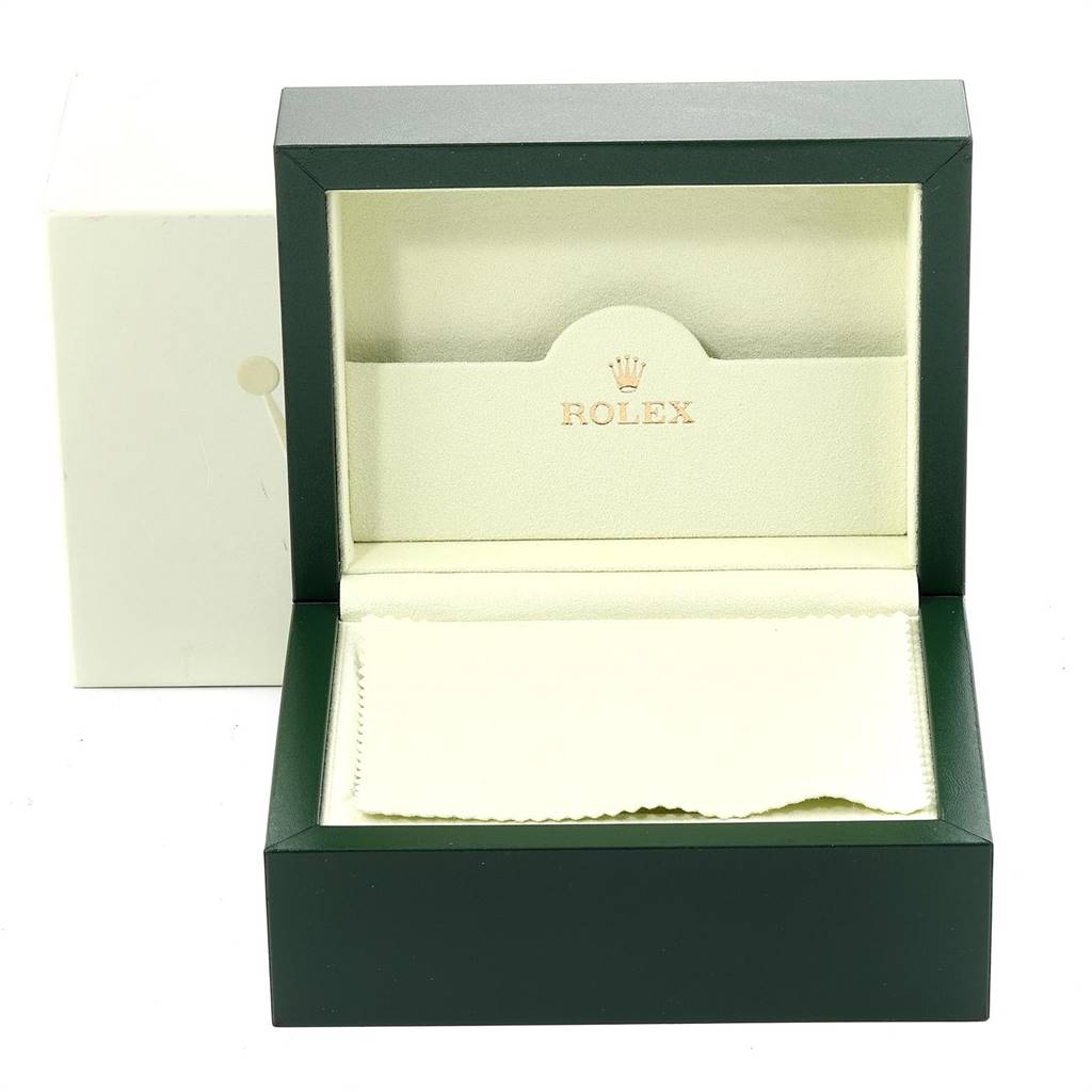 The image shows an open Rolex Datejust 116233 Men's Stainless Steel Champagne Dial 116233 Men's Stainless Steel Champagne Dial watch box with a beige interior and a cleaning cloth.