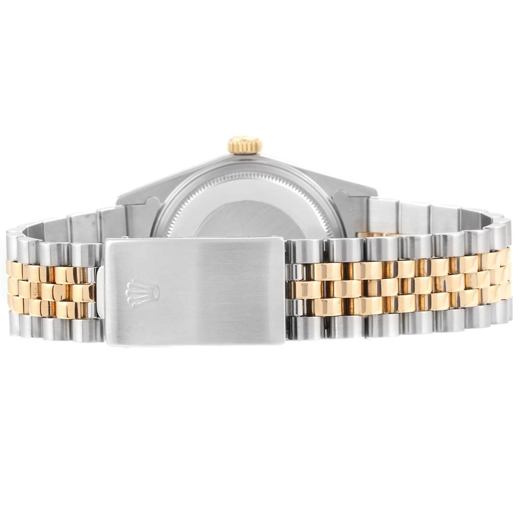 This image shows the back and bracelet of a Rolex Datejust 16013 Men's Stainless Steel Champagne Dial 16013 Men's Stainless Steel Champagne Dial, highlighting its two-tone metal links and clasp.