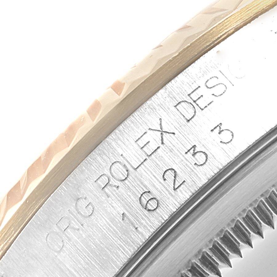 This image shows a close-up of the watch case and engraved model number "16233" on the Rolex Datejust 16233 Men's Steel and Gold (two tone) White Dial 16233 Men's Steel and Gold (two tone) White Dial.