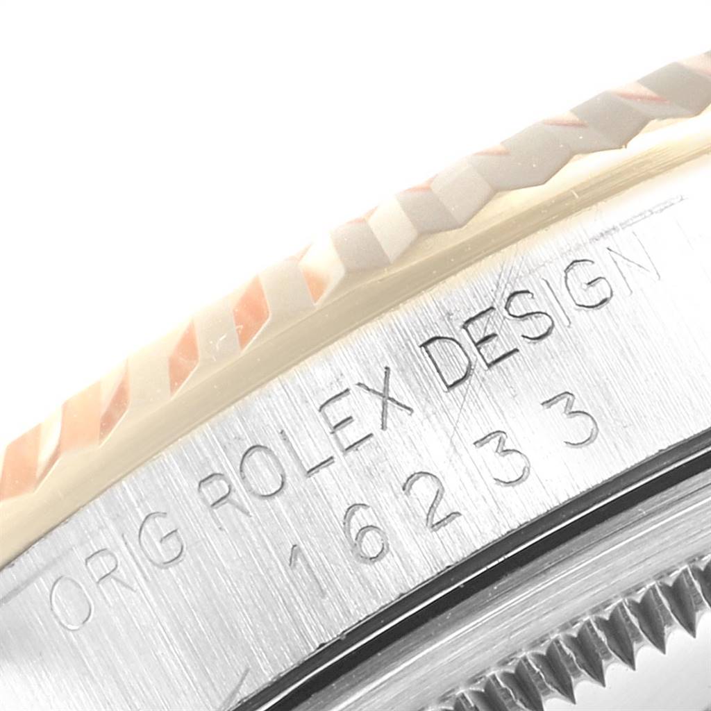 The image shows a close-up of the side of a Rolex Datejust 16233 Men's Steel and Gold (two tone) Black Dial 16233 Men's Steel and Gold (two tone) Black Dial watch, featuring the model number and fluted bezel.