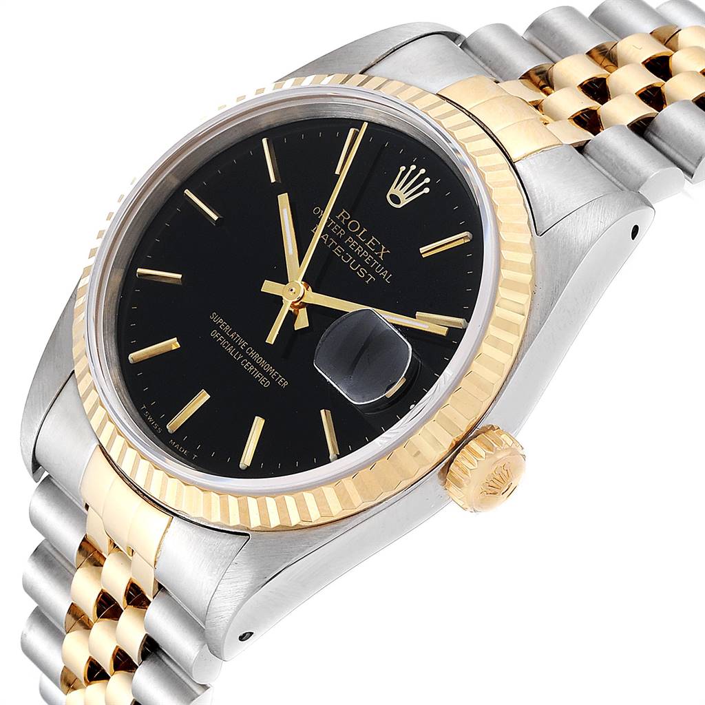 This image shows a close-up angle of the face, bezel, and part of the bracelet of a Rolex Datejust 16233 Men's Steel and Gold (two tone) Black Dial 16233 Men's Steel and Gold (two tone) Black Dial watch.