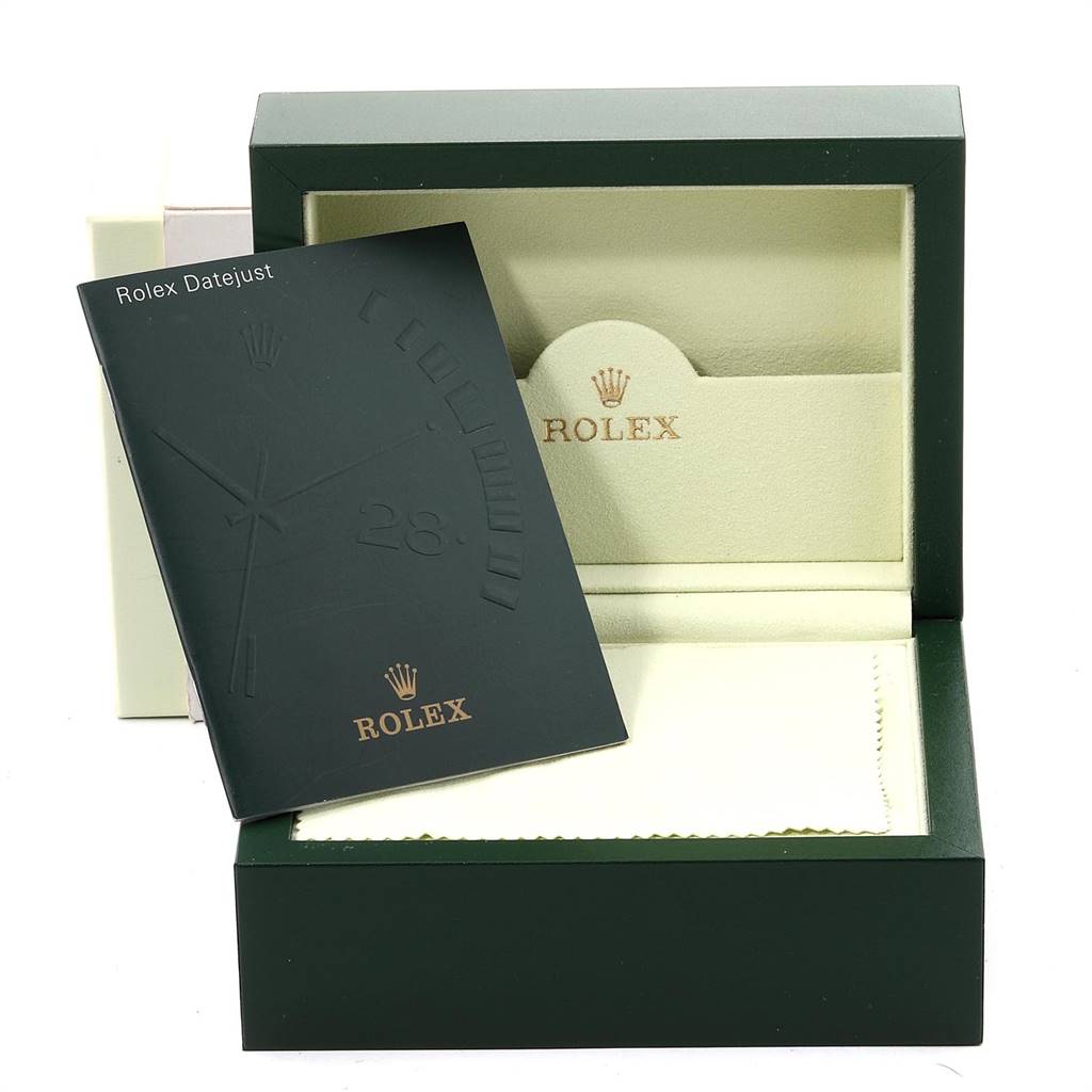 The image shows the Rolex Datejust 116233 Men's Stainless Steel Champagne Dial 116233 Men's Stainless Steel Champagne Dial watch box, manual, and a cream-colored cloth, with parts of the packaging visible.