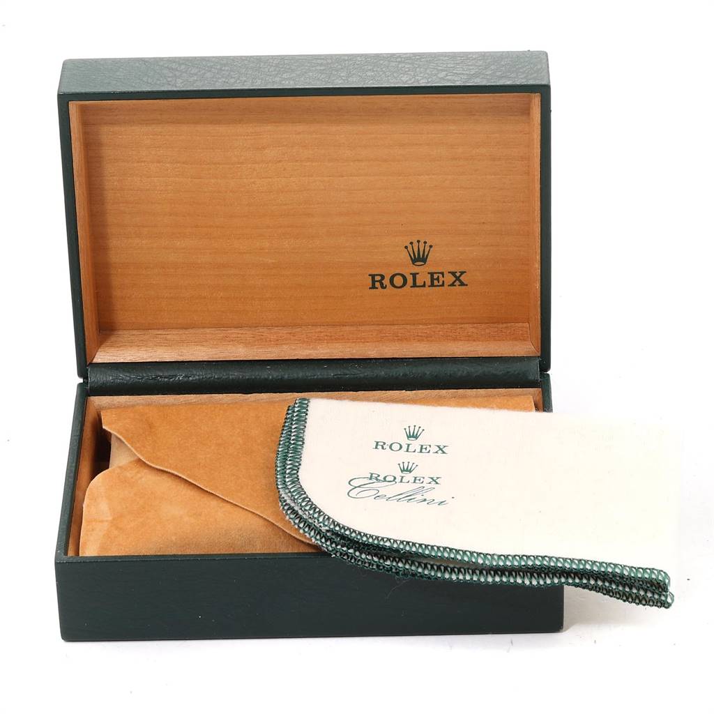 This image shows an open Rolex Datejust 16233 Men's Steel and Gold (two tone) White Dial 16233 Men's Steel and Gold (two tone) White Dial watch box alongside a Rolex cleaning cloth.