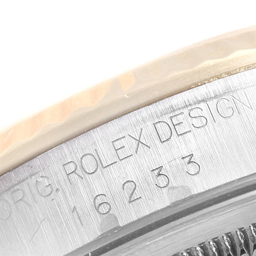 This close-up angle shows the engraved model number on the side of a Rolex Datejust 16233 Men's Steel and Gold (two tone) White Dial 16233 Men's Steel and Gold (two tone) White Dial watch case.
