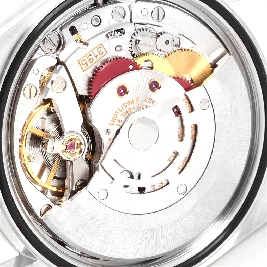 This image shows the intricate internal movement mechanism of a Rolex Datejust 16233 Men's Steel and Gold (two tone) White Dial 16233 Men's Steel and Gold (two tone) White Dial watch at a close-up angle.