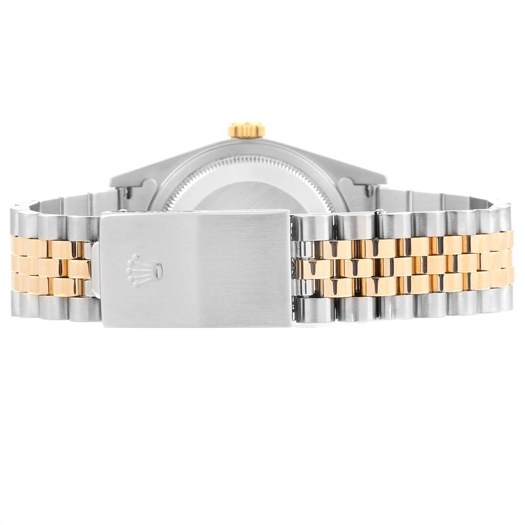 The image shows the back view of a Rolex Datejust 16233 Men's Steel and Gold (two tone) White Dial 16233 Men's Steel and Gold (two tone) White Dial watch, highlighting its two-tone bracelet and clasp.
