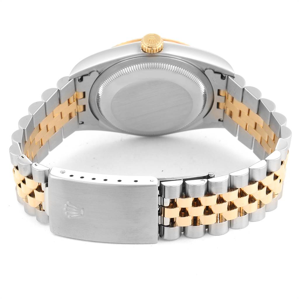 The image shows the back casing, crown, and jubilee bracelet of a Rolex Datejust 16233 Men
s Steel and Gold (two tone) Champagne Dial 16233 Men
s Steel and Gold (two tone) Champagne Dial watch from a rear angle.
