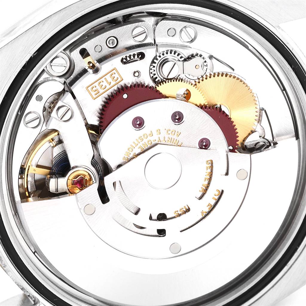 This is a close-up view of the Rolex Datejust 116233 Men's Stainless Steel Silver Dial 116233 Men's Stainless Steel Silver Dial watch movement, showing the intricate inner mechanical parts.