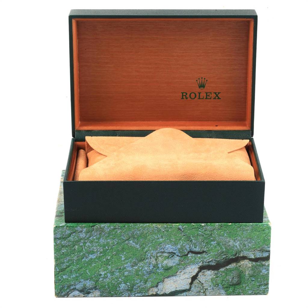 This image shows a Rolex Datejust 116233 Men's Stainless Steel Black Dial 116233 Men's Stainless Steel Black Dial watch box, including an outer decorative wrapper and an open inner box with a suede cover.