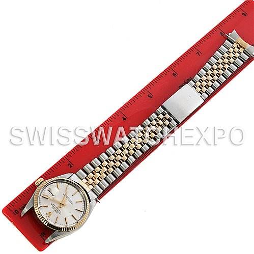 The image shows a Rolex Datejust 16013 Men's Stainless Steel Silver Dial 16013 Men's Stainless Steel Silver Dial watch laid flat next to a red ruler, displaying the full bracelet and watch face.